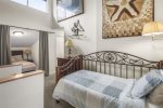Loft with twin and queen bed and bathroom 